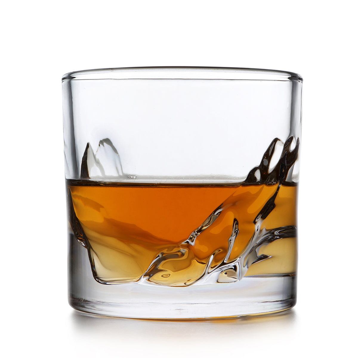 Liiton Grand Canyon Whiskey Glass filled with whiskey, showcasing intricate rock-like base design.